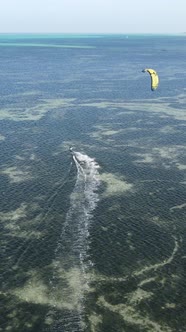 Tanzania  Vertical Video Kitesurfing Near the Shore of Zanzibar Slow Motion alt