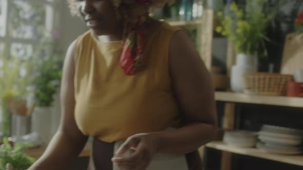 Food Blogger Brushing Buns with Glaze before Baking alt
