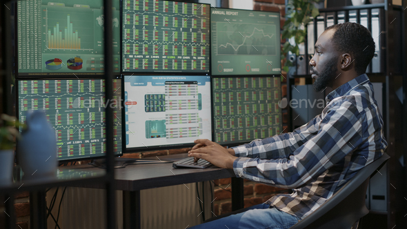 Portrait of male broker working on stock market statistics