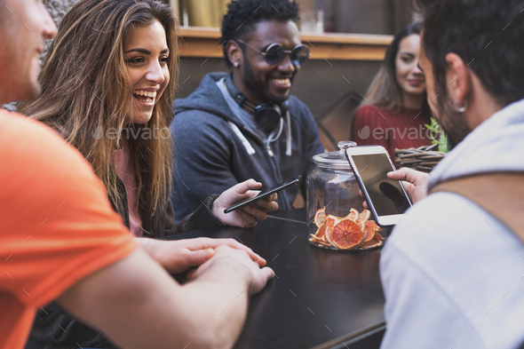 Twenties using smartphone at cafe