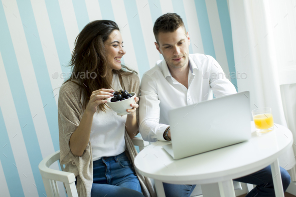 Couple websurfing at home - Stock Photo - Images