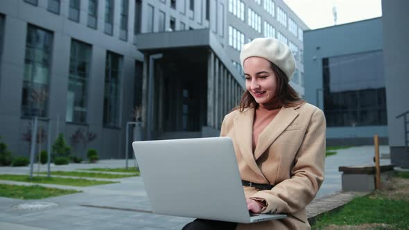 Brunette Business Woman Laptop Outside in Beautiful Style on Business Center alt