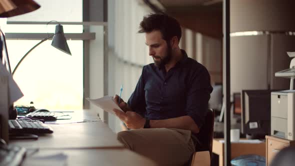 Graphic Designer Overworked On Computer. Office Worker Overtime Work In Internet. Modern Office. alt