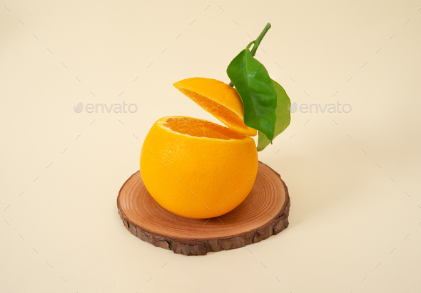 sliced navel orange in acrobatic position colored gradient - Stock Photo - Images