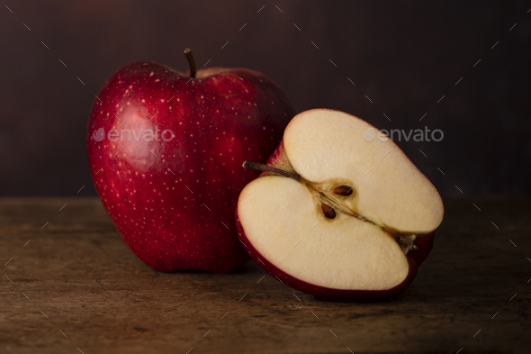 One Whole Apple and One Half Apple on a Wooden Old Surface. - Stock Photo - Images
