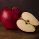One Whole Apple and One Half Apple on a Wooden Old Surface. - PhotoDune Item for Sale
