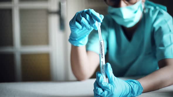 Doctor taking samples from coronavirus COVID-19 test tube