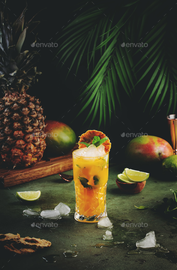 Alcoholic cocktail with vodka, pineapple juice, mango, liquor, ice. Long drink or summer