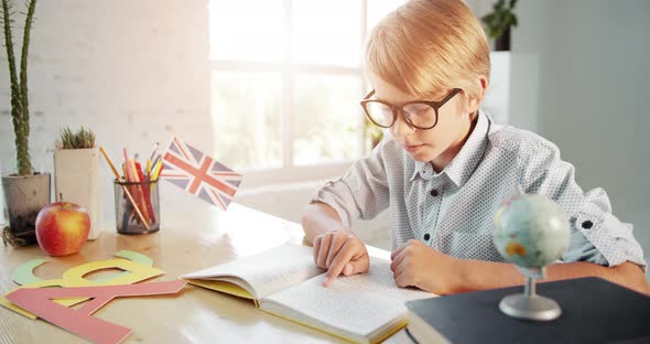 Boy Reading English Textbook