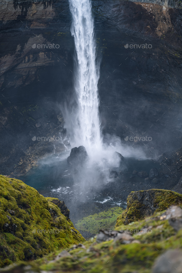Close up of Haifoss waterfall in South Iceland. Water is crashing against the rocks on the bottom - Stock Photo - Images