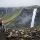 Woman with backpack and lilac jacket enjoying Haifoss waterfall of Iceland Highlands in - PhotoDune Item for Sale