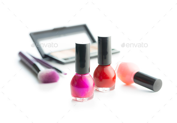 Set of cosmetic makeup products. Eyeshadow, nail polish and makeup brushes isolated on white - Stock Photo - Images