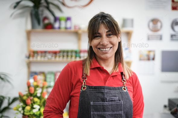 Mature latin woman working in a supermarket