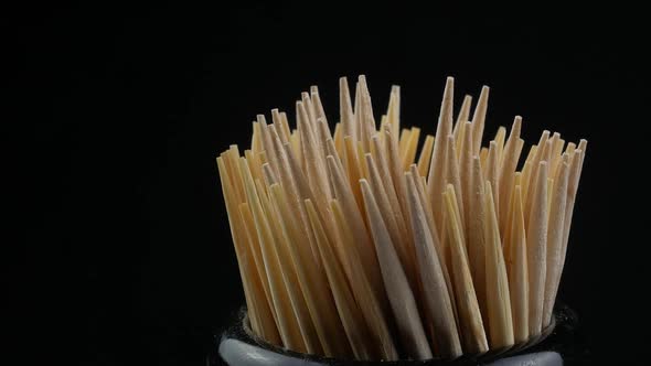 Close up of a group of wooden toothpicks alt