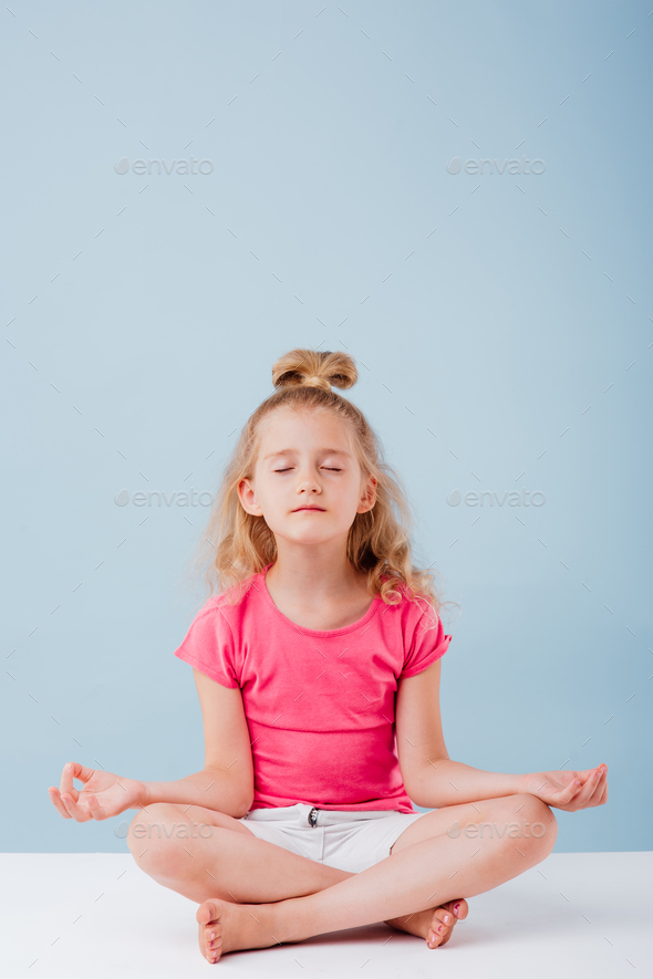 little girl in yoga pose Stock Photo by alexlucru123 | PhotoDune