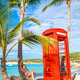 Beautiftul kid near red phone booth in Dickenson&#39;s bay Antigua - PhotoDune Item for Sale