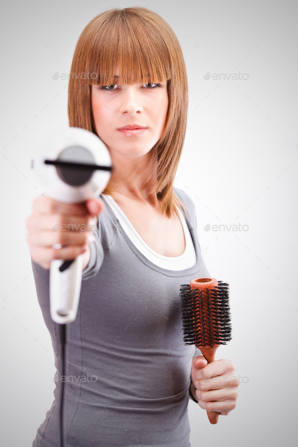 Armed hairdresser - Stock Photo - Images