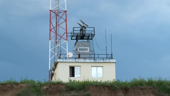 Rotating Coastal Radar Station at the Top of the Cliff