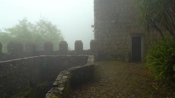 Defensive Guard Tower Wall of Moors Castle with Very Thick Fog and Mist Covering Area alt