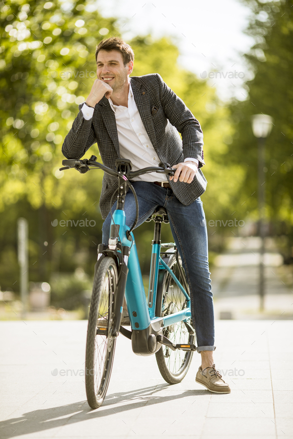 Young businessman on the ebike - Stock Photo - Images