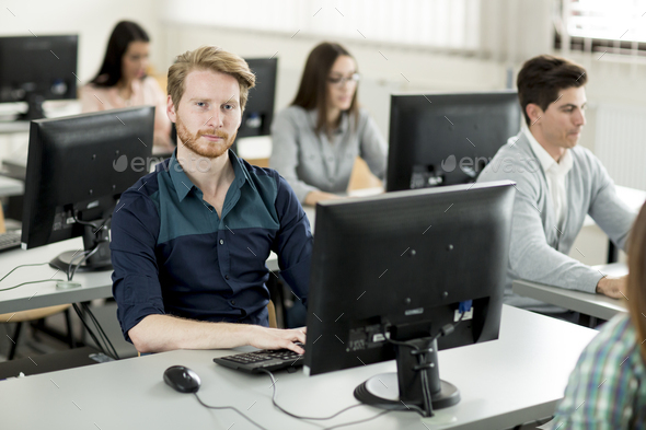 Young people in the classroom Stock Photo by BGStock72 | PhotoDune