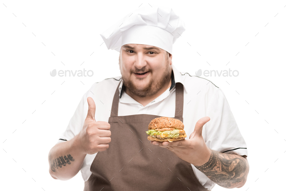 smiling cooker with burger in hand showing thumb up isolated on white ...