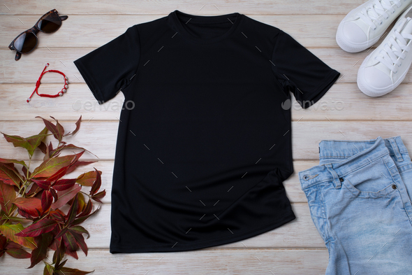 Mens black T-shirt mockup with wild grass and bracelet - Stock Photo - Images