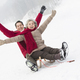 Happy senior couple sliding on a sled - PhotoDune Item for Sale