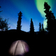 Taiga tent illuminated under northern lights flare - PhotoDune Item for Sale