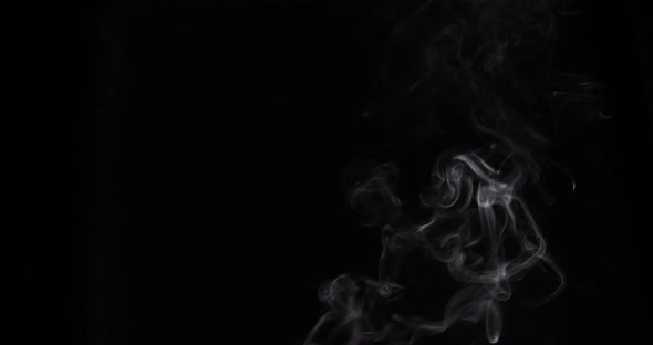 Smoke VFX Video Element isolated on black background. Great for compositing into your project alt
