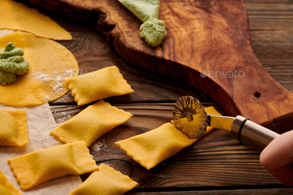Raw homemade ravioli pasta with spinach and ricotta - Stock Photo - Images