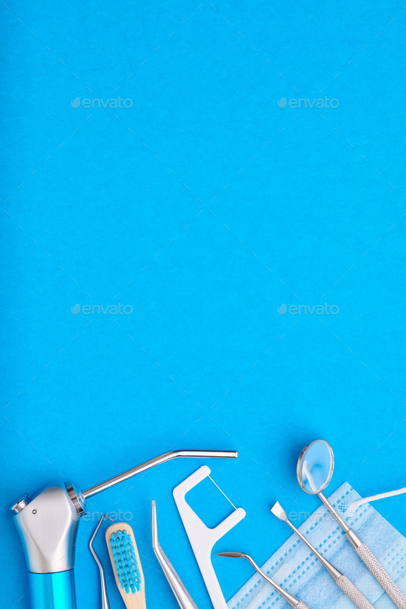 Dentist tools over blue background top view - Stock Photo - Images