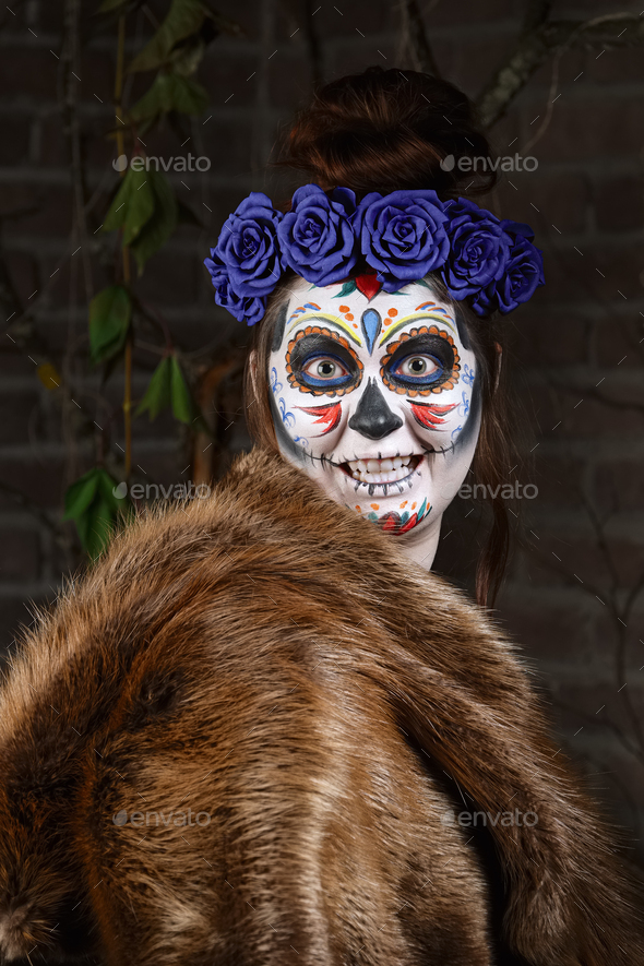 Female sugar skull makeup. Face painting art.