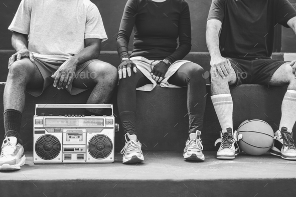 Group of young african people listening music - Focus on boombox stereo - Black and white editing
