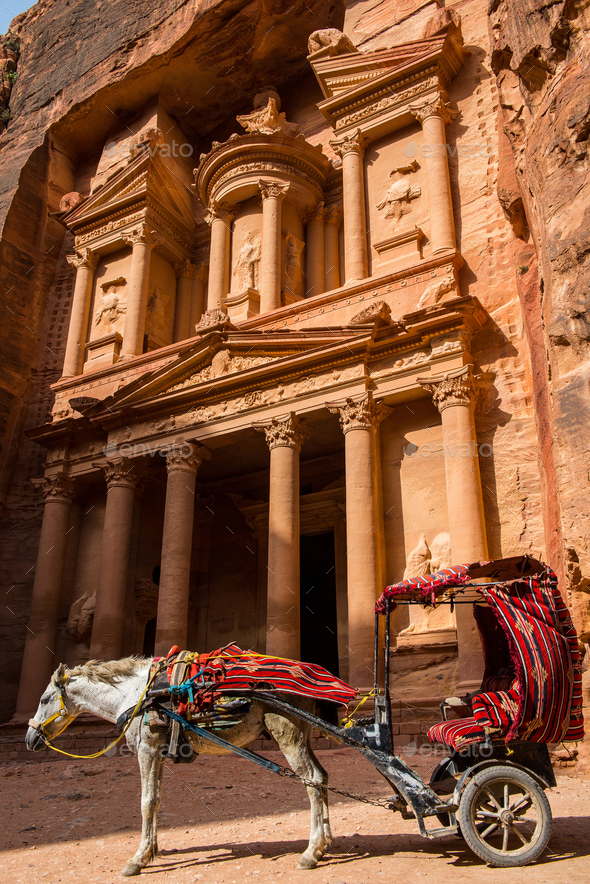 Horse carriage in the front of Treasury. Petra, Jordan. Ancient stone carving