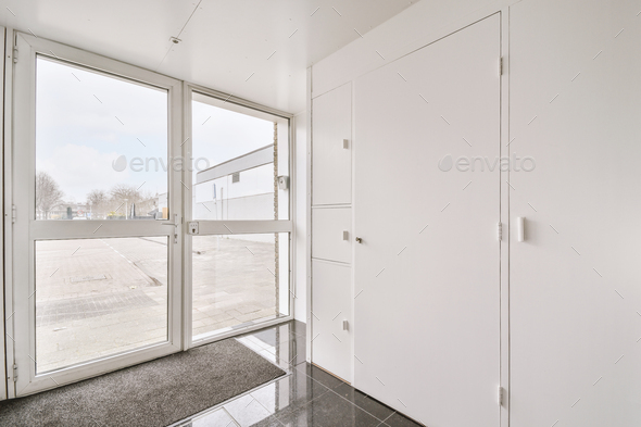 Doorway of modern apartment with white walls