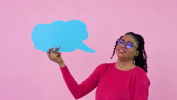 Young African American Girl in Pink Clothes Stands with Posters for Expression on a Solid Pink alt