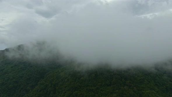 Amazing scenic cinematic forward view of clouds from the top of the mountain alt