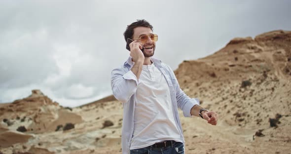 Handsome Guy with the Sunglasses Speaking on the alt