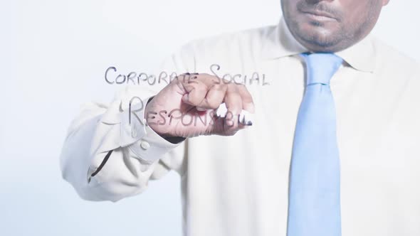 Asian Businessman Writes Corporate Social Responsibility