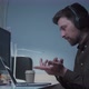 A Male Software Developer Makes a Videocall with Coworkers While Sitting at His Computer and Using p - VideoHive Item for Sale