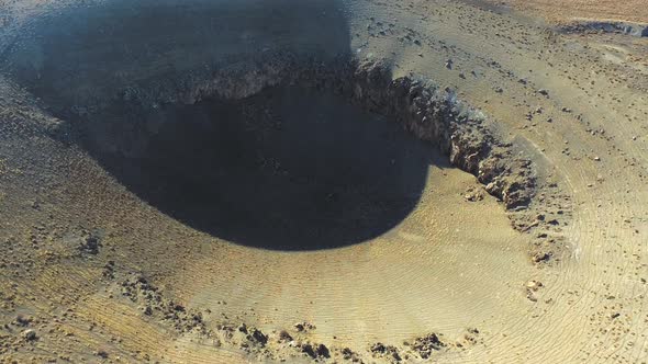 Sinkhole Pit Resulting From Collapse in Flat Terrain alt
