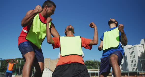 Soccer players celebrating on the field alt