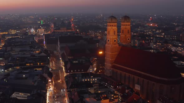 The Famous Frauenkirche Church Cathedral in Munich at Night Aerial Dolly Forward Approaching Two alt