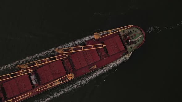 Top View Merchant Cargo Bulker with Closed Holds Filled Coarse Grain Sailing Open Sea alt