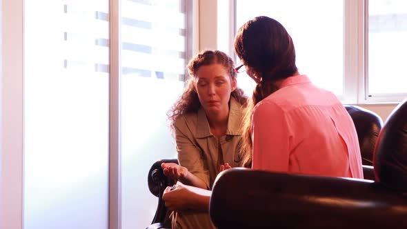 Female patient having discussion with therapist alt