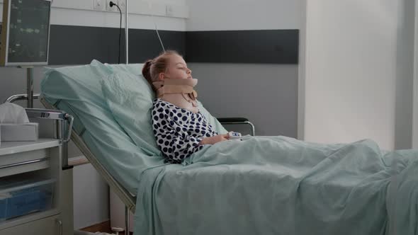 Sick Patient Resting in Bed Wearing Neck Cervical Collar Having Health Injury alt