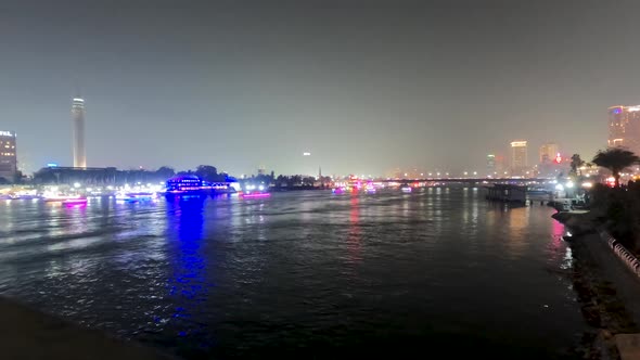 Nile river and iconic Cairo night cityscape, Egypt. Wide shot timelapse