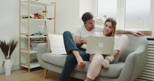 In the Morning Couple in Pajamas in a Stylish alt