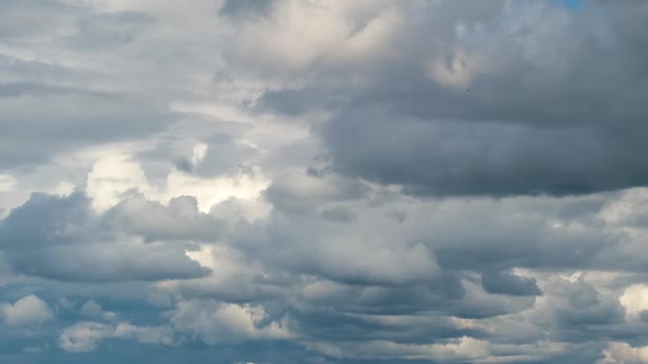 Time Lapse Footage of Fast Moving White Puffy Cumulus Clouds on Blue Clear Sky alt